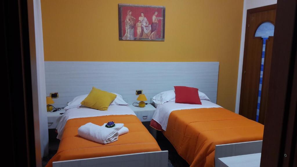 Łóżko lub łóżka w pokoju w obiekcie B&B Cornelia
