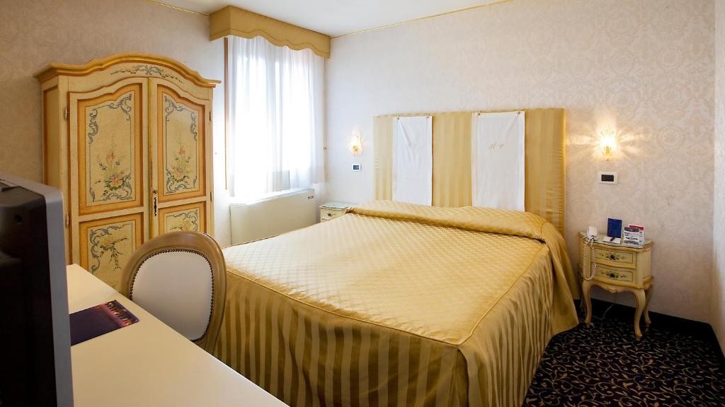Postel nebo postele na pokoji v ubytování Hotel Principe