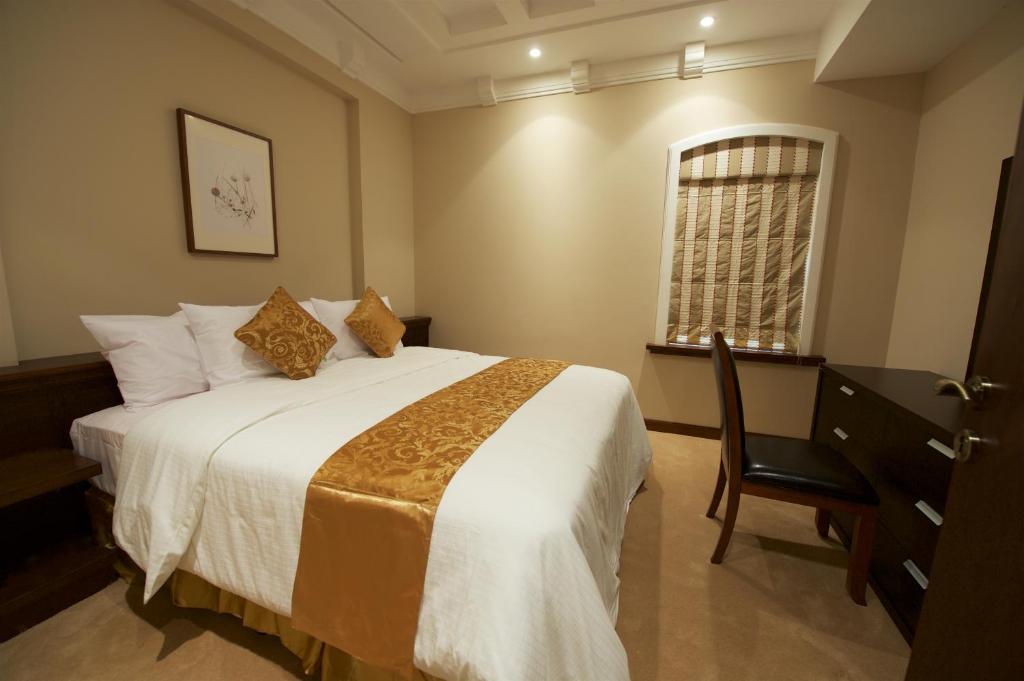 Postel nebo postele na pokoji v ubytování Rawasi Hotel Apartments