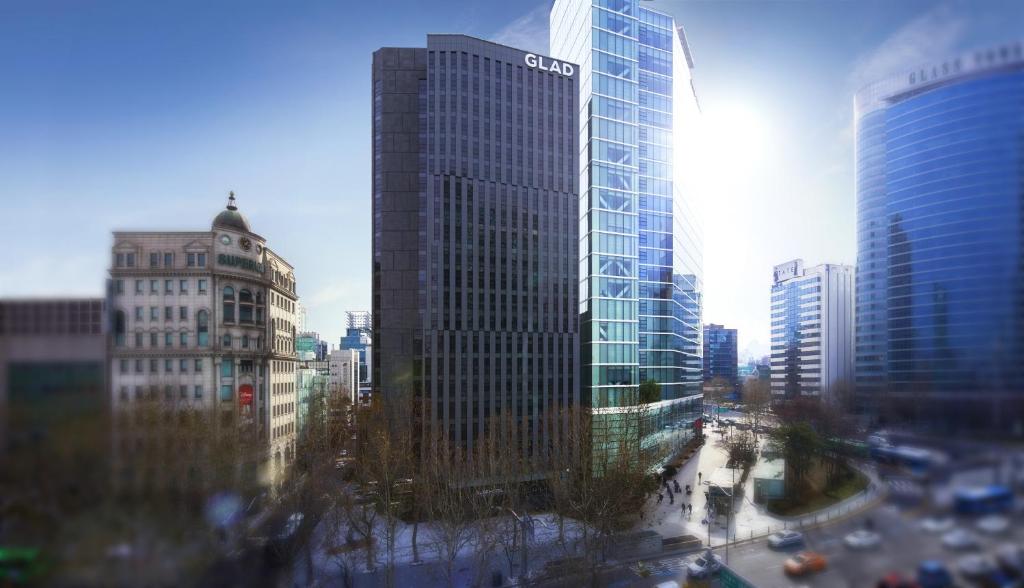 a view of a city skyline with tall buildings at GLAD Gangnam COEX Center in Seoul