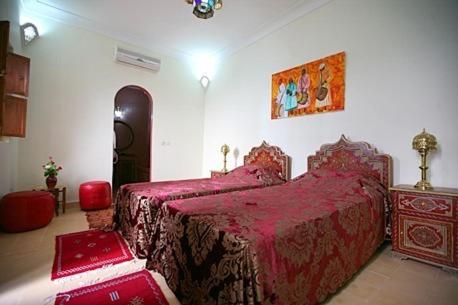 Postel nebo postele na pokoji v ubytování Riad Morgane