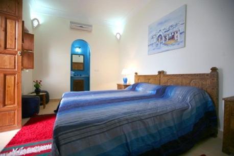 Postel nebo postele na pokoji v ubytování Riad Morgane