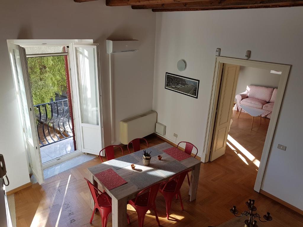 a living room with a table and chairs and a couch at Boutique House Montevergini in Palermo