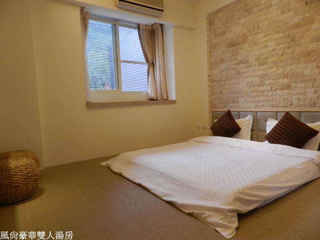 Postel nebo postele na pokoji v ubytování 谷關明高溫泉 Mingao Hot Spring Resort