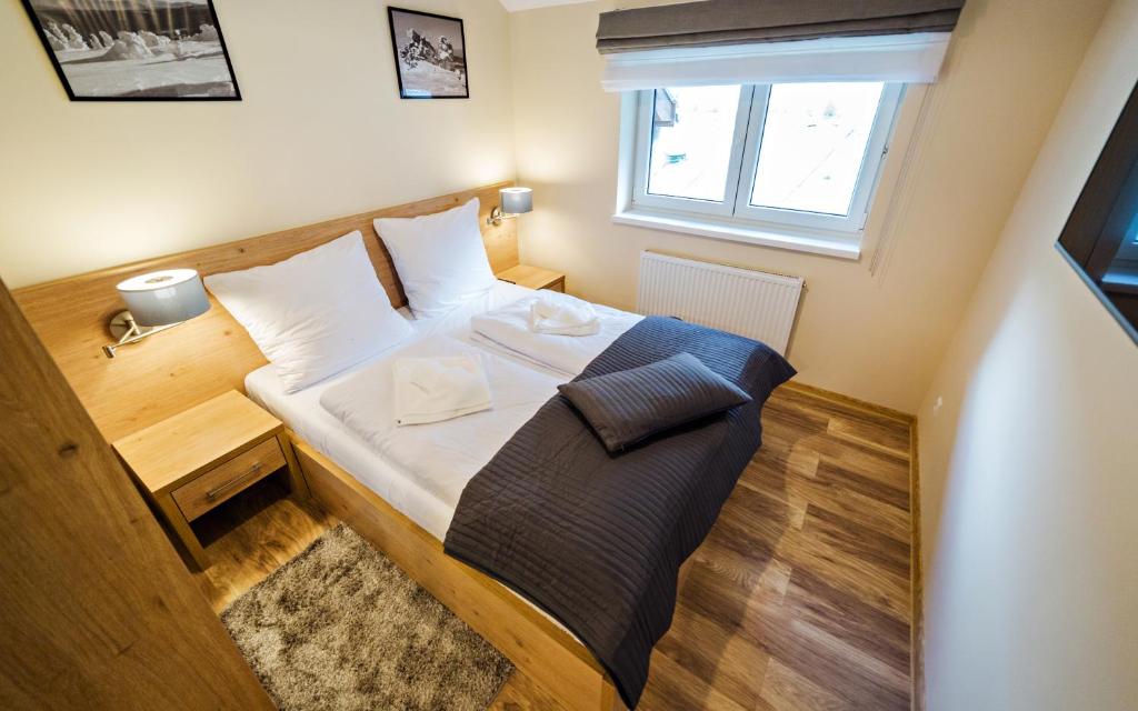 Posteľ alebo postele v izbe v ubytovaní Apartamenty Sun & Snow Szklarska Perła