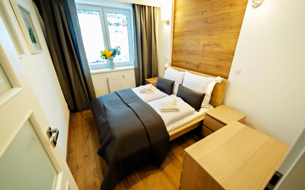 Posteľ alebo postele v izbe v ubytovaní Apartamenty Sun & Snow Szklarska Perła