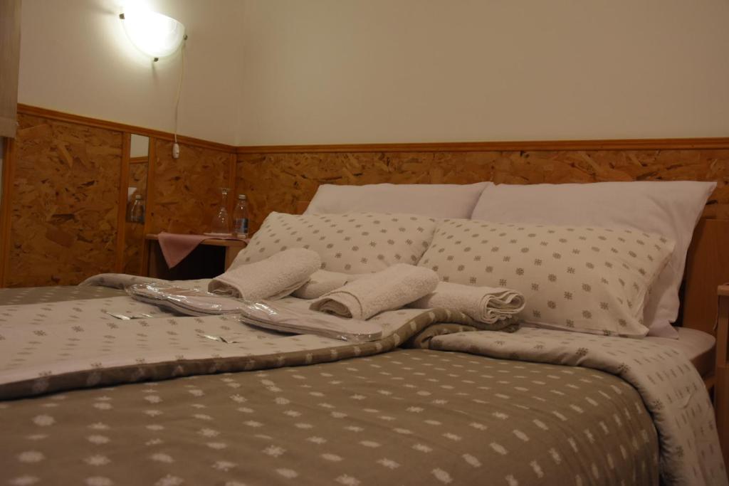 Postel nebo postele na pokoji v ubytování Hotel Duga