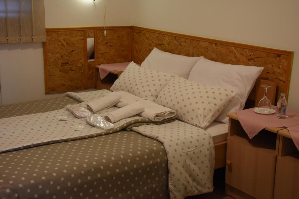 Postel nebo postele na pokoji v ubytování Hotel Duga
