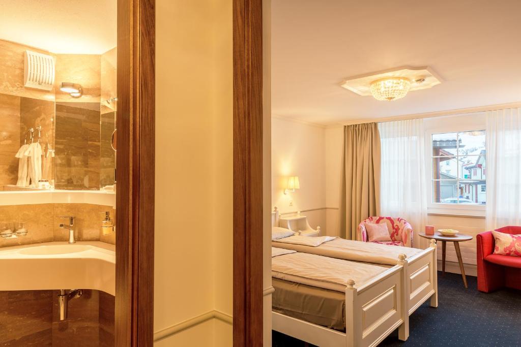 Postel nebo postele na pokoji v ubytování Hotel Appenzell