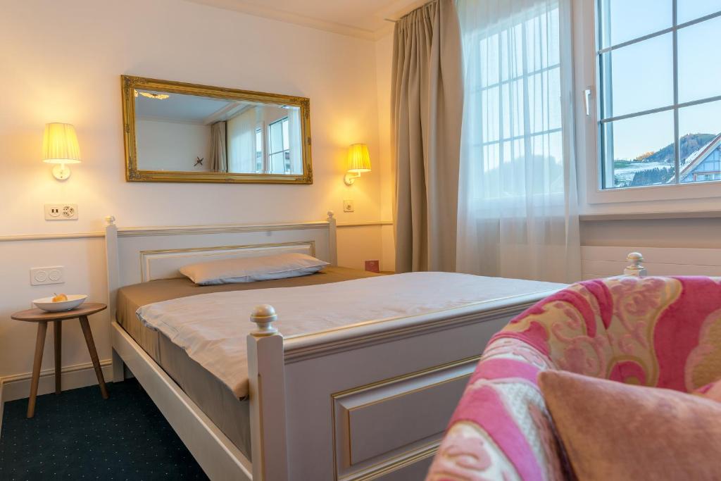 Postel nebo postele na pokoji v ubytování Hotel Appenzell
