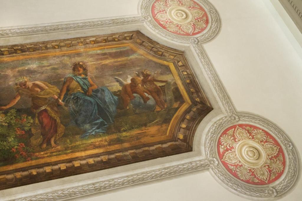 a painting on the ceiling of a room at Hotel Villa Delle Rose in Rome
