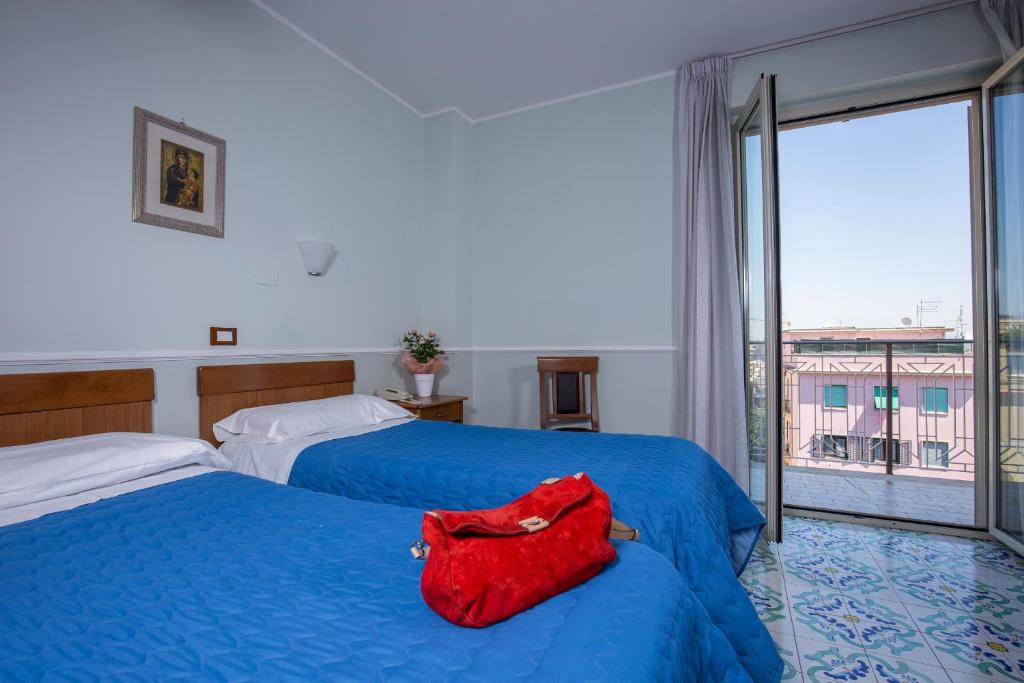 Postel nebo postele na pokoji v ubytování Hotel Casa Tra Noi