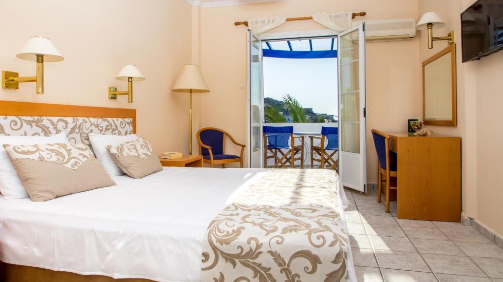 Postel nebo postele na pokoji v ubytování Syros Atlantis