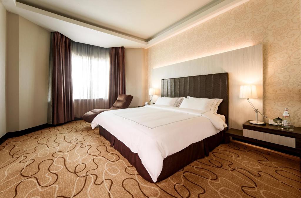 Postel nebo postele na pokoji v ubytování Promenade Hotel Kota Kinabalu
