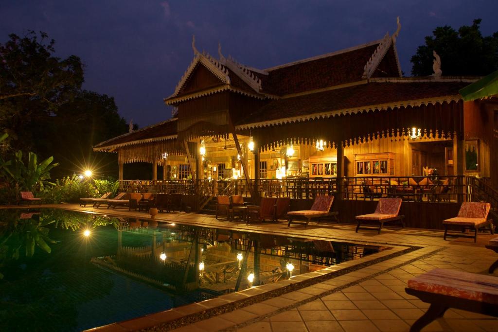 a resort with a swimming pool at night at Soriyabori Villas Resort in Kratie