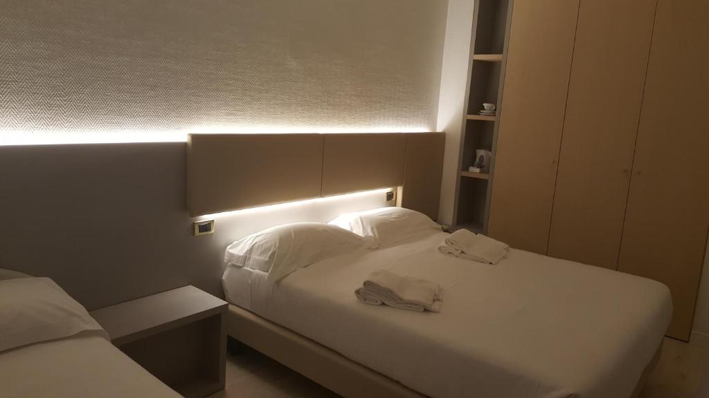 Postel nebo postele na pokoji v ubytování Hotel Augustus