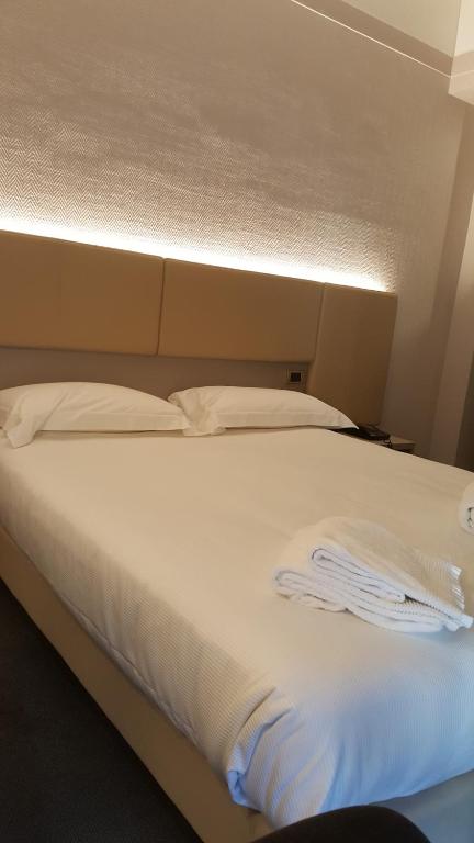 Postel nebo postele na pokoji v ubytování Hotel Augustus