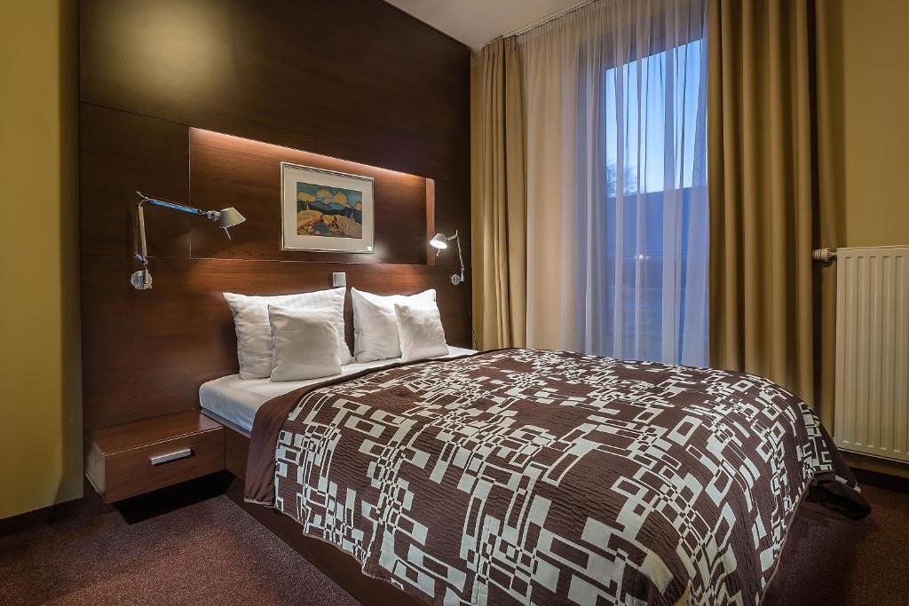 Postel nebo postele na pokoji v ubytování Hotel Villa Bianca