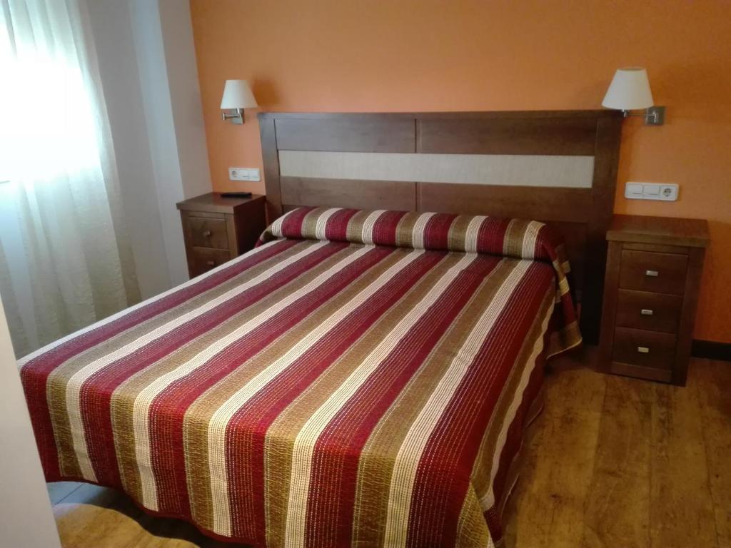 Posteľ alebo postele v izbe v ubytovaní Hostal Patrón