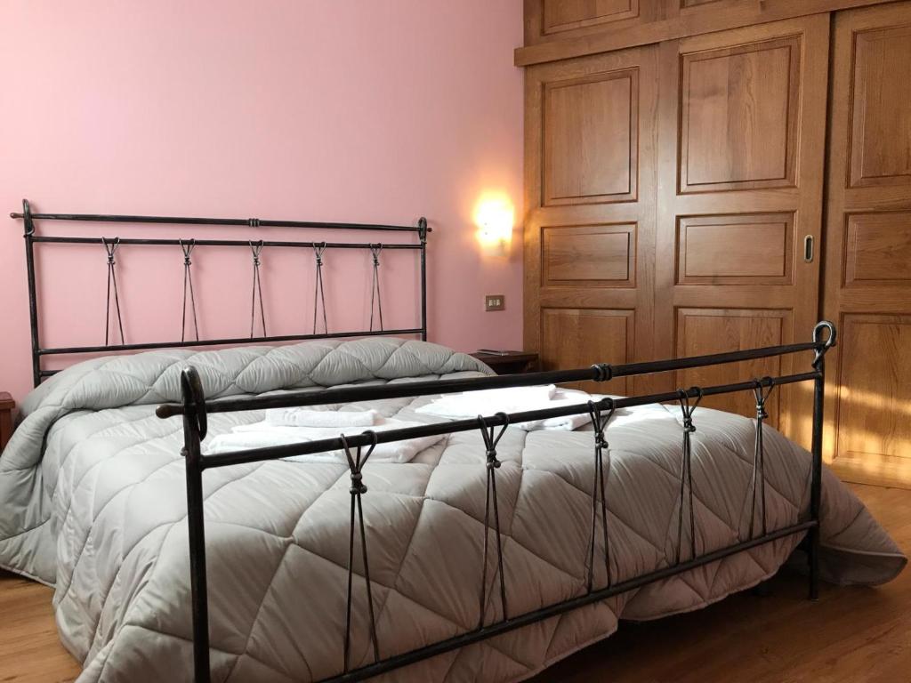 Postel nebo postele na pokoji v ubytování Hotel Olimpic