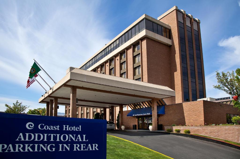 a building with a sign in front of it at Coast Wenatchee Center Hotel in Wenatchee