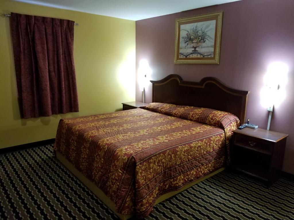 Postel nebo postele na pokoji v ubytování Cottage Inn - Grantville