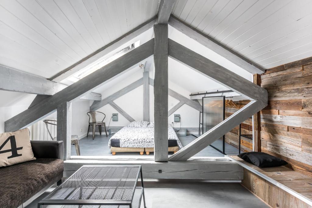 Ένα ή περισσότερα κρεβάτια σε δωμάτιο στο Annecy Clara's Apartment