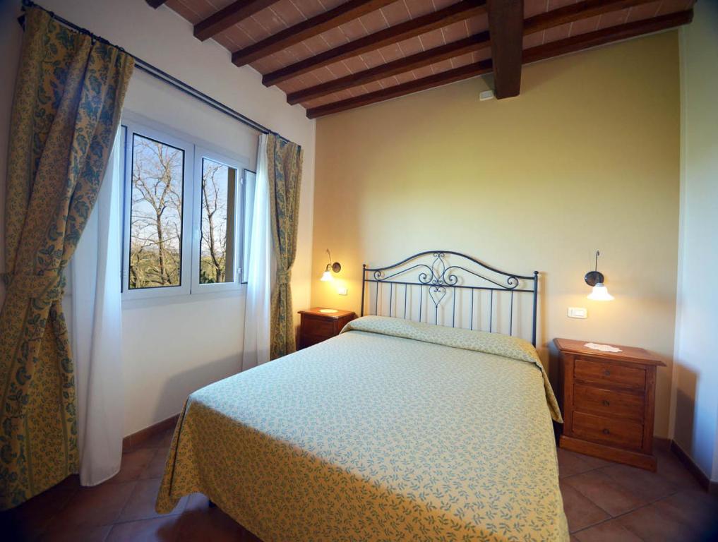 Postel nebo postele na pokoji v ubytování Agriturismo L'Imposto