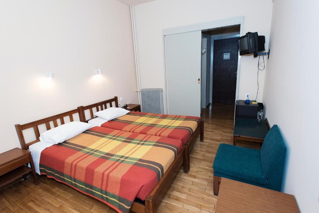 Postel nebo postele na pokoji v ubytování Hotel Alexandros