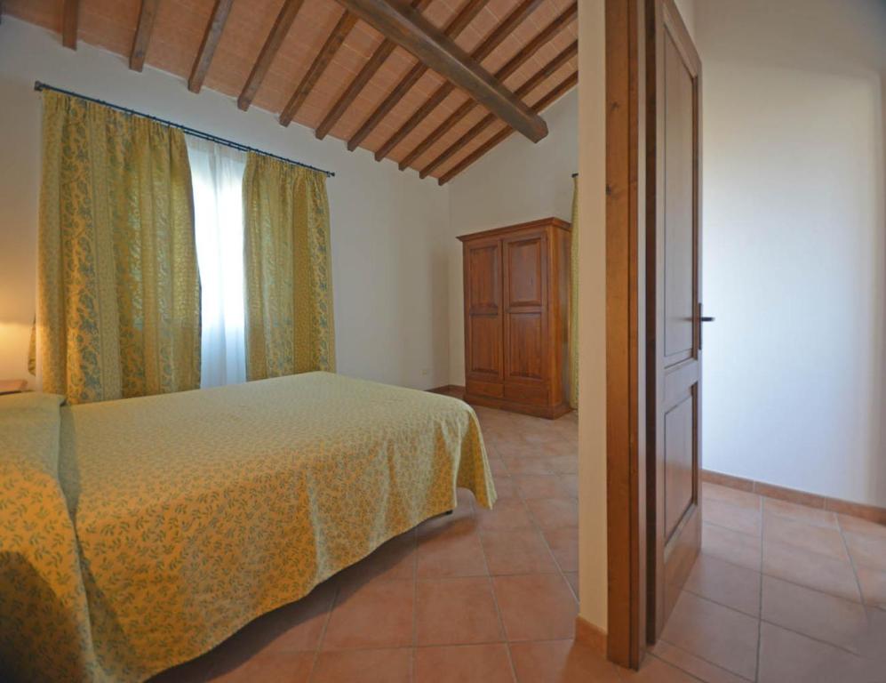 Postel nebo postele na pokoji v ubytování Agriturismo L'Imposto