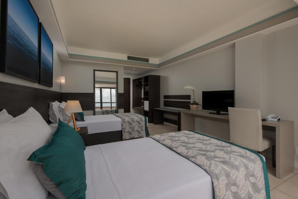 Cama ou camas em um quarto em Wish Natal