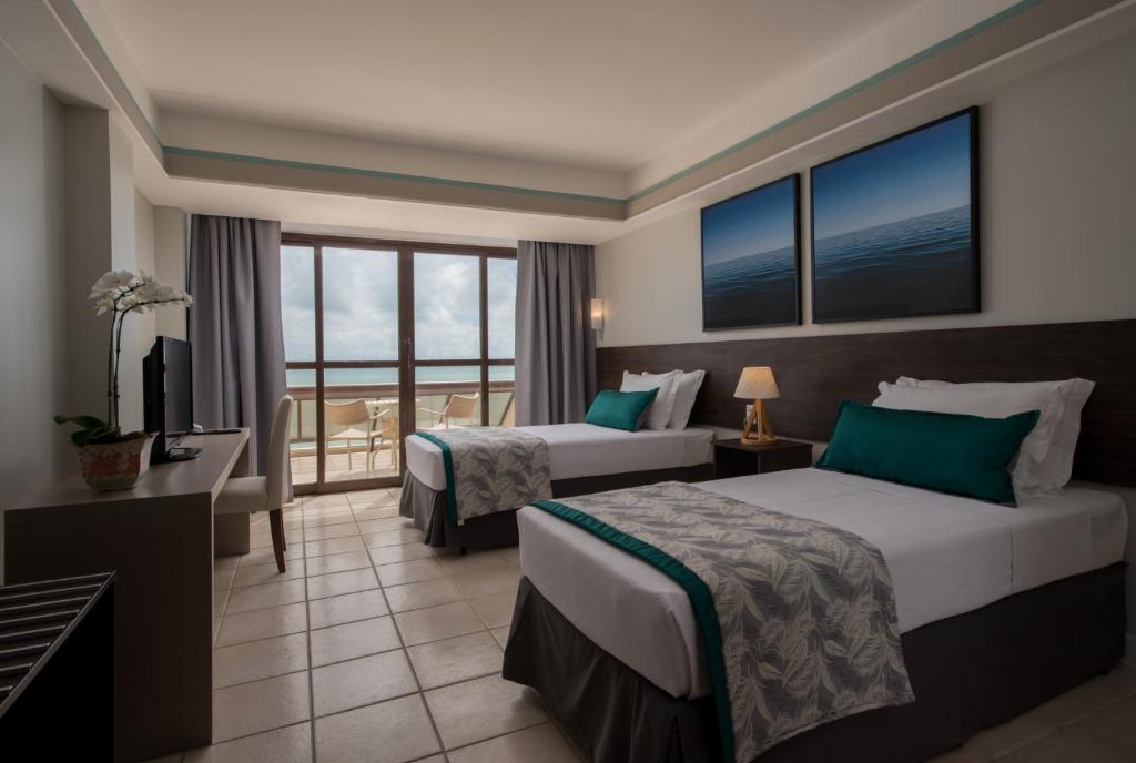 Cama ou camas em um quarto em Wish Natal