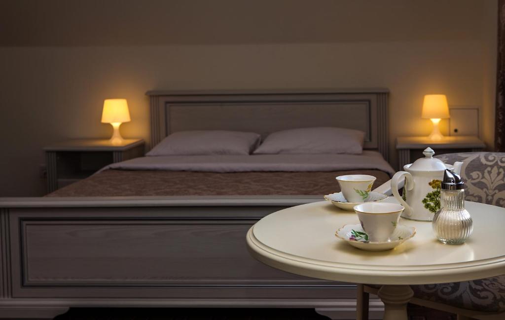 Postel nebo postele na pokoji v ubytování Mini Hotel Ryleev