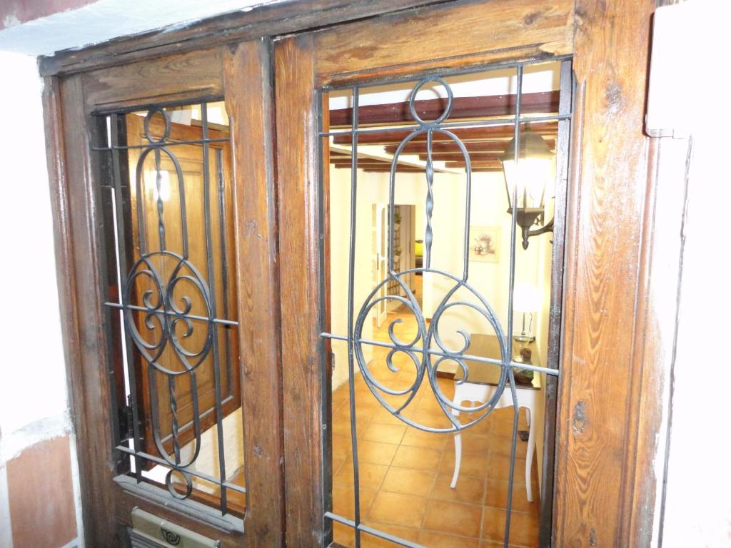 a wooden door with iron bars on it at Center Valencia in Valencia