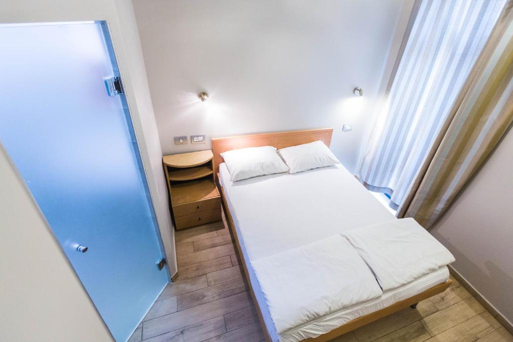Postel nebo postele na pokoji v ubytování Kaplan Hotel