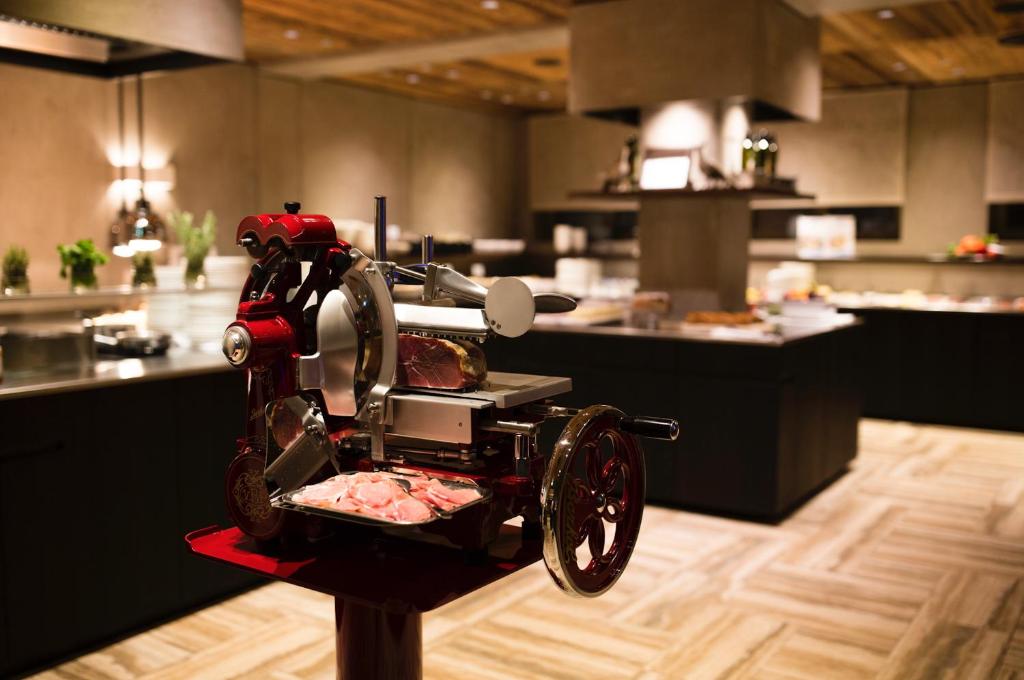 a red machine on display in a kitchen at ElisabethHotel Premium Private Retreat- Adults only in Mayrhofen