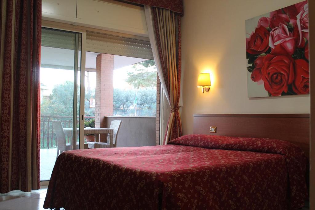 Postel nebo postele na pokoji v ubytování Hotel Vitti