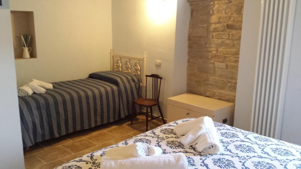 Postel nebo postele na pokoji v ubytování Valbuona b&b