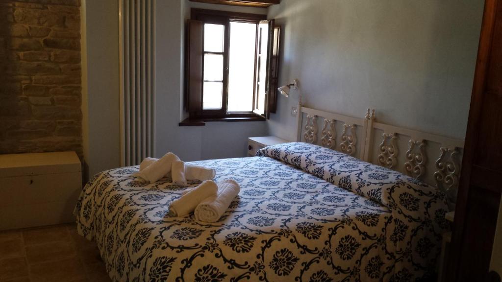 Postel nebo postele na pokoji v ubytování Valbuona b&b