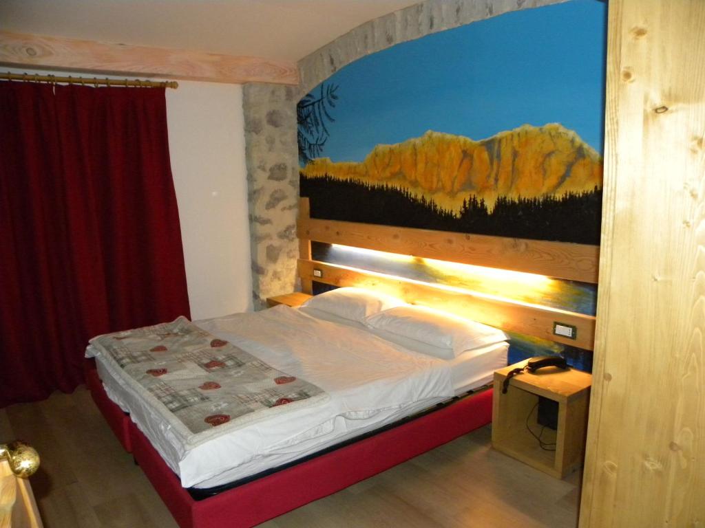Postel nebo postele na pokoji v ubytování Hotel Cova