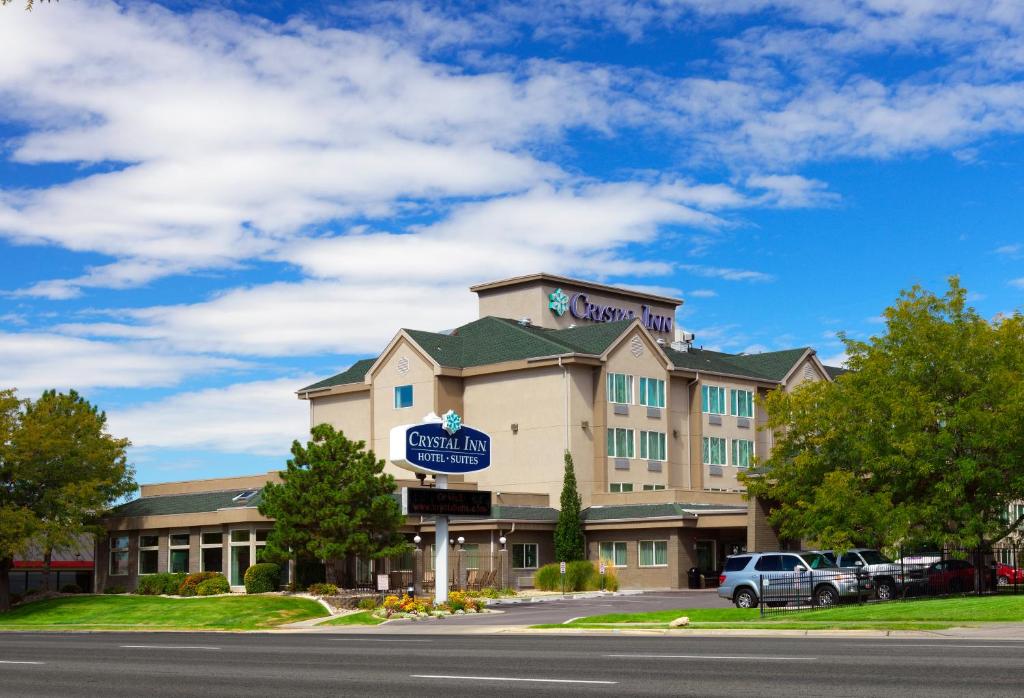 a hotel with a sign on the front of it at Crystal Inn Hotel & Suites - Salt Lake City in Salt Lake City