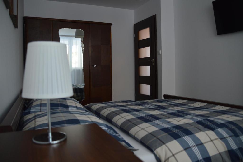 Posteľ alebo postele v izbe v ubytovaní Apartament Izerski Klimat