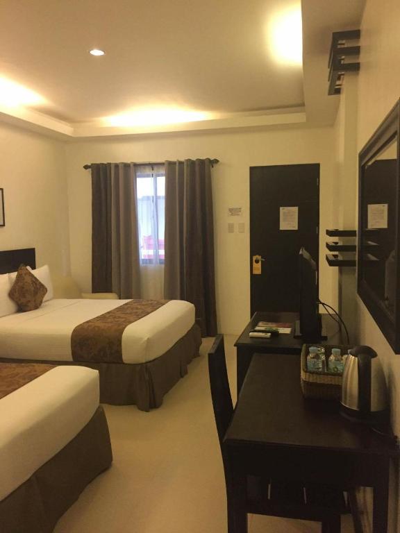Postel nebo postele na pokoji v ubytování Chateau De Boracay