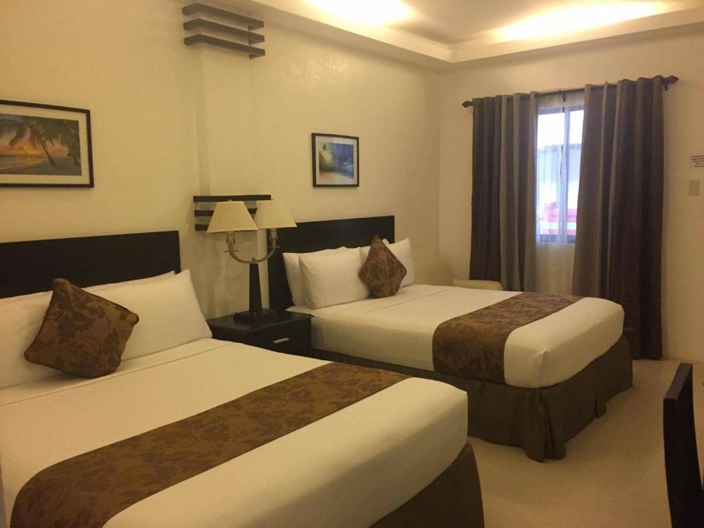 Postel nebo postele na pokoji v ubytování Chateau De Boracay