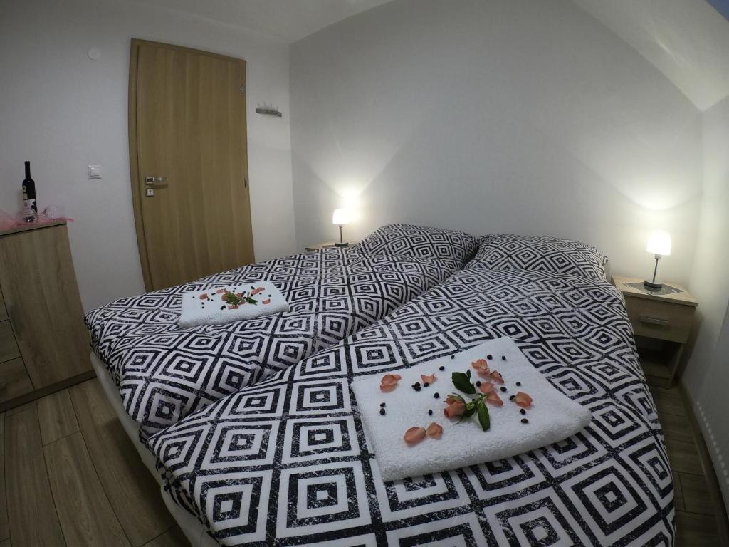 Postel nebo postele na pokoji v ubytování Pizzéria Viktória
