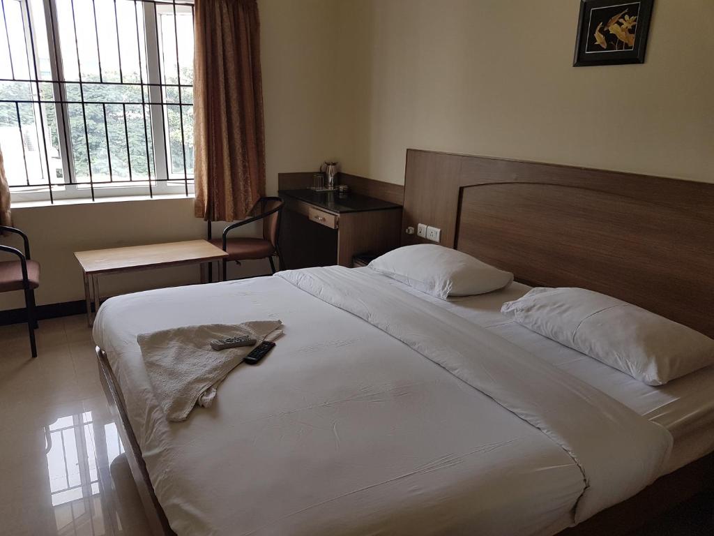 Postel nebo postele na pokoji v ubytování SK Residency