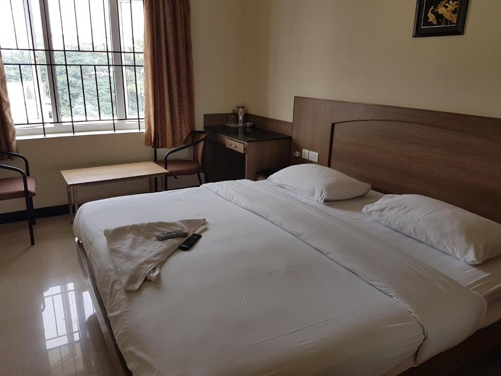 Postel nebo postele na pokoji v ubytování SK Residency