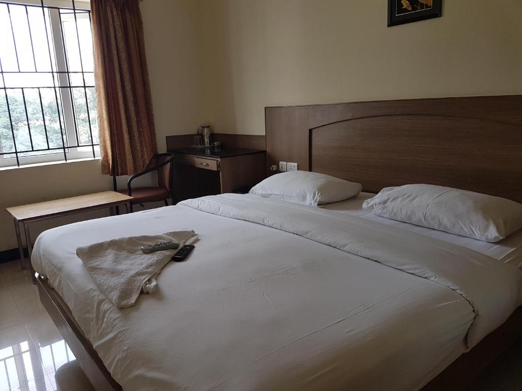 Postel nebo postele na pokoji v ubytování SK Residency