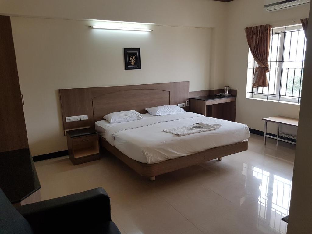 Postel nebo postele na pokoji v ubytování SK Residency