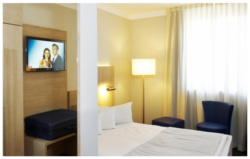 Postel nebo postele na pokoji v ubytování Stern Hotel Soller